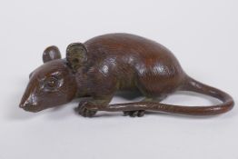 A Japanese style bronze okimono rat, impressed mark to base, 9cm long