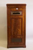 A Victorian figured mahogany letter box, the single door with a brass letter slot and fielded panel,