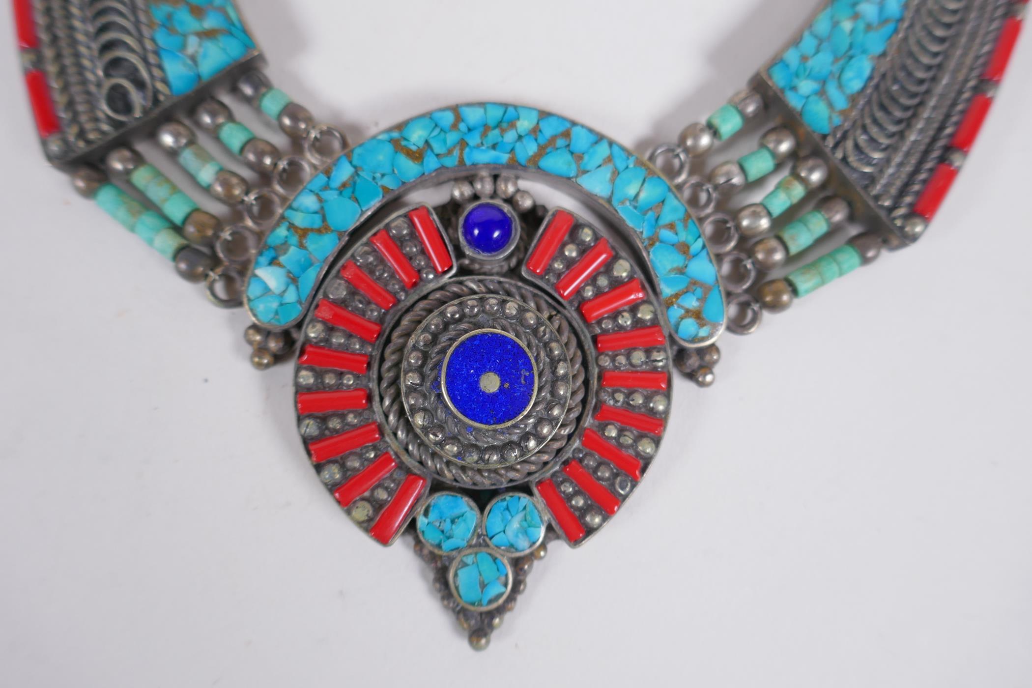 A Tibetan white metal necklace set with turquoise shards and coral, 40cm long - Image 2 of 4