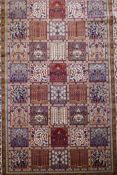 A full pile ivory ground Kashmir carpet with a Persian panel design, 156 x 230cm