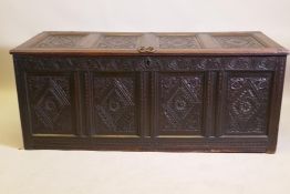 An C18th continental carved oak four panel coffer, 157 x 65cm, 63cm high