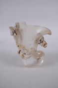 A Chinese glass libation cup with kylin, dragon and phoenix decoration, 9cm high