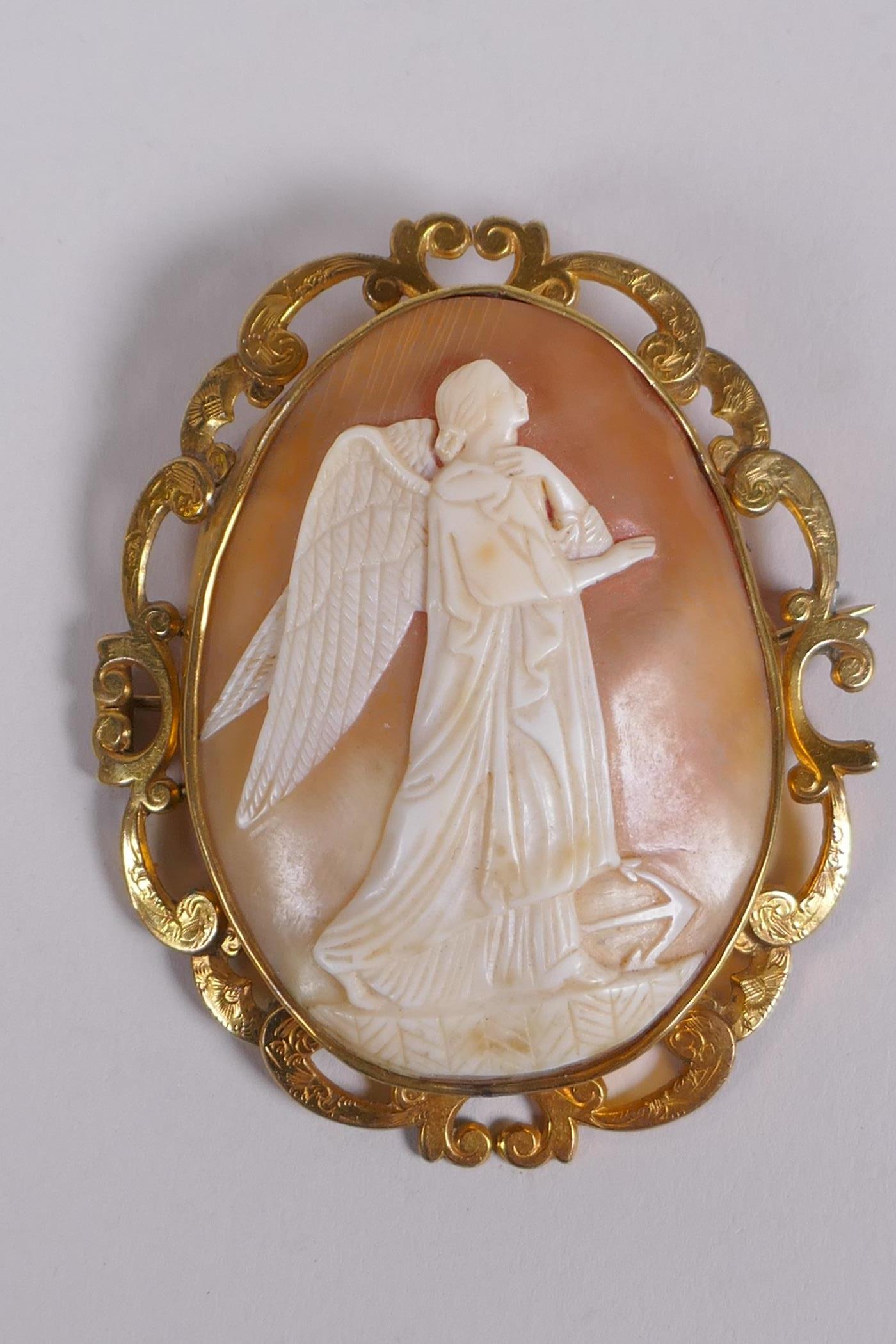 A Victorian gilt metal cameo brooch decorated with an angel and anchor, 6 x 7cm