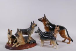 Royal Doulton figure of a German Shepherd dog, two Goebel figures of the same and another, largest
