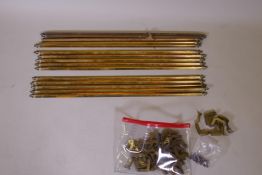 A quantity of vintage solid brass stair rods of triangular form with fleur de lis finials and