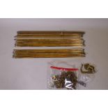 A quantity of vintage solid brass stair rods of triangular form with fleur de lis finials and