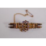 A 15ct gold buckle brooch, set with diamonds and sapphires, 4.2cm long, 3.9g