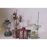 An Akrom pressurised spirit lamp, a brass lamp, garden lanterns AF, and laboratory stands