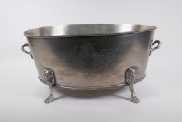 A silver plated champagne cooler with two handles, lion's mask and paw feet, 52 x 35cm, 24cm high