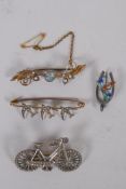 A Victorian silver bicycle brooch, 1896, 3.7g, 4cm long, a silver wishbone brooch with enamelled