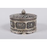 A Sino Tibetan white metal cylinder censer and cover, decorated with the emblems of the eight