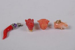 A coral pendant with silver mount set with a n amethyst and white stones, 3cm long, a coral pig with