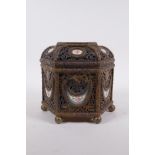 A C19th French pierced ormolu jewellery casket of hexagonal form, with inset Sevres porcelain floral