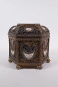 A C19th French pierced ormolu jewellery casket of hexagonal form, with inset Sevres porcelain floral