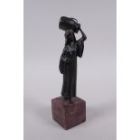 After Bergman, cold painted bronze of a water carrier, 19cm high