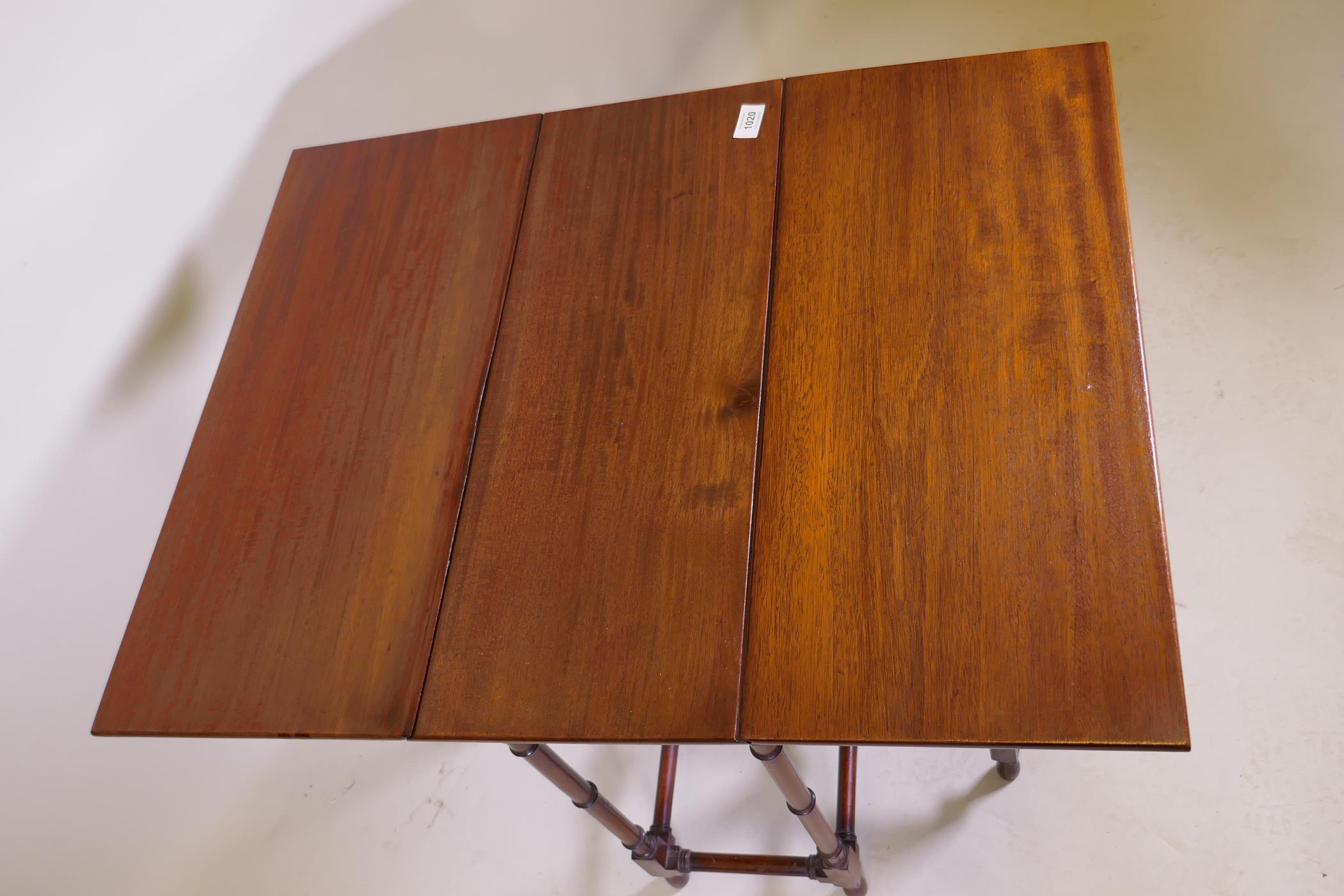 A Victorian mahogany spider gateleg table on ring turned supports, 61 x 26cm, 66cm high, 61 x 78cm - Image 3 of 3