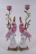 A pair of porcelain and gilt metal pink cockatoo candlesticks, 41cm high