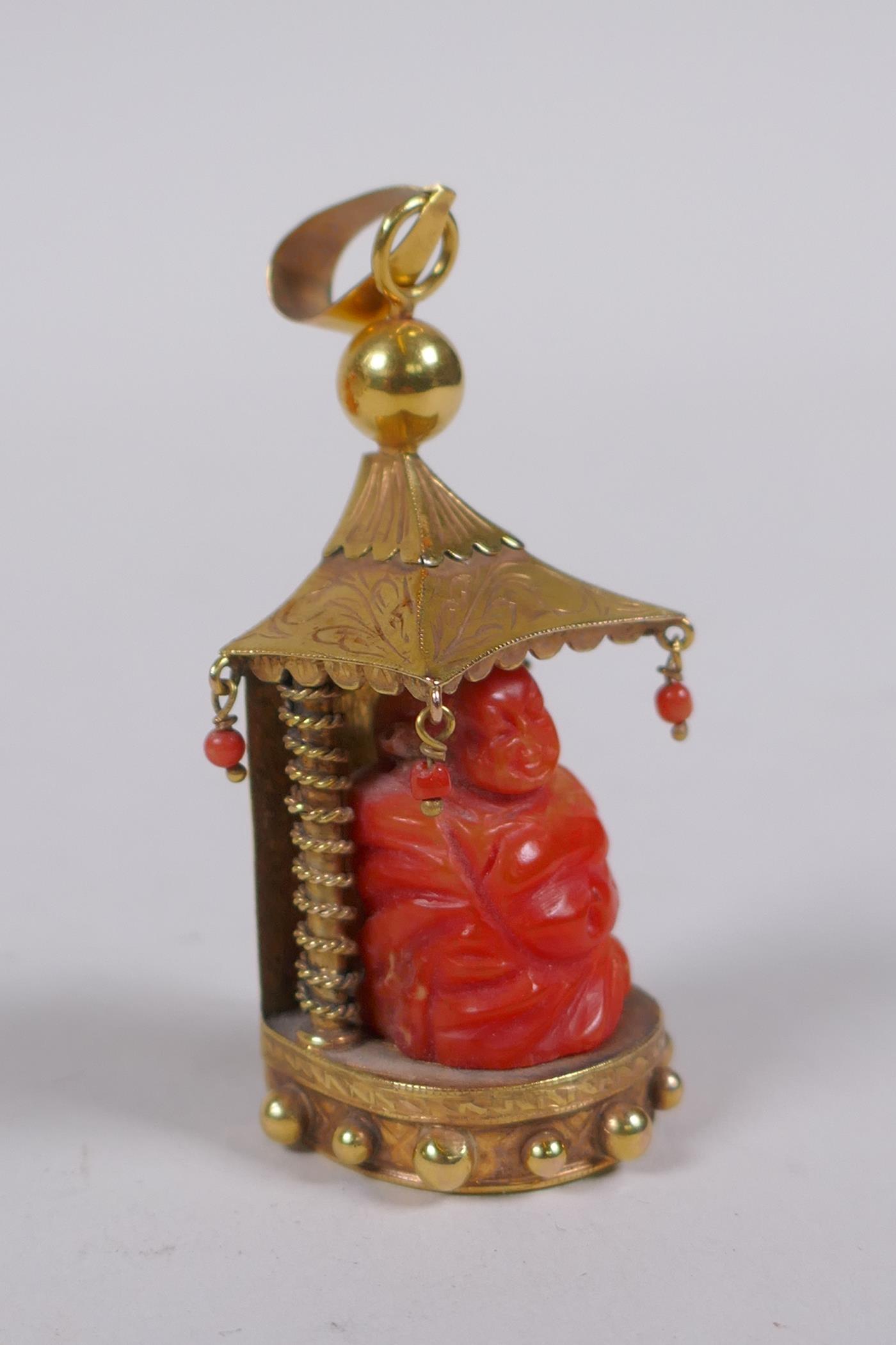 A 9ct gold pendant in the form of a shrine with carved coral figure of Buddha, 22.2g gross - Image 2 of 6