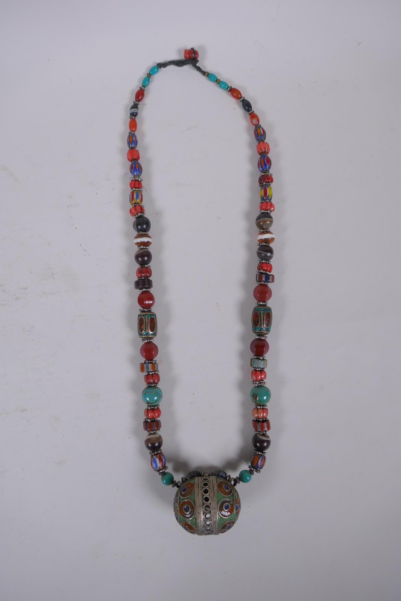 An oriental enamelled white metal, agate, coral, turquoise and multicolour glass bead necklace, 62cm