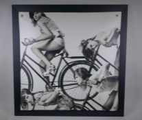 A photographic print on canvas of bike riding girls, 70 x 70cm
