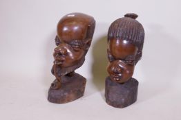 A large pair of African carved hardwood busts, 50cm high