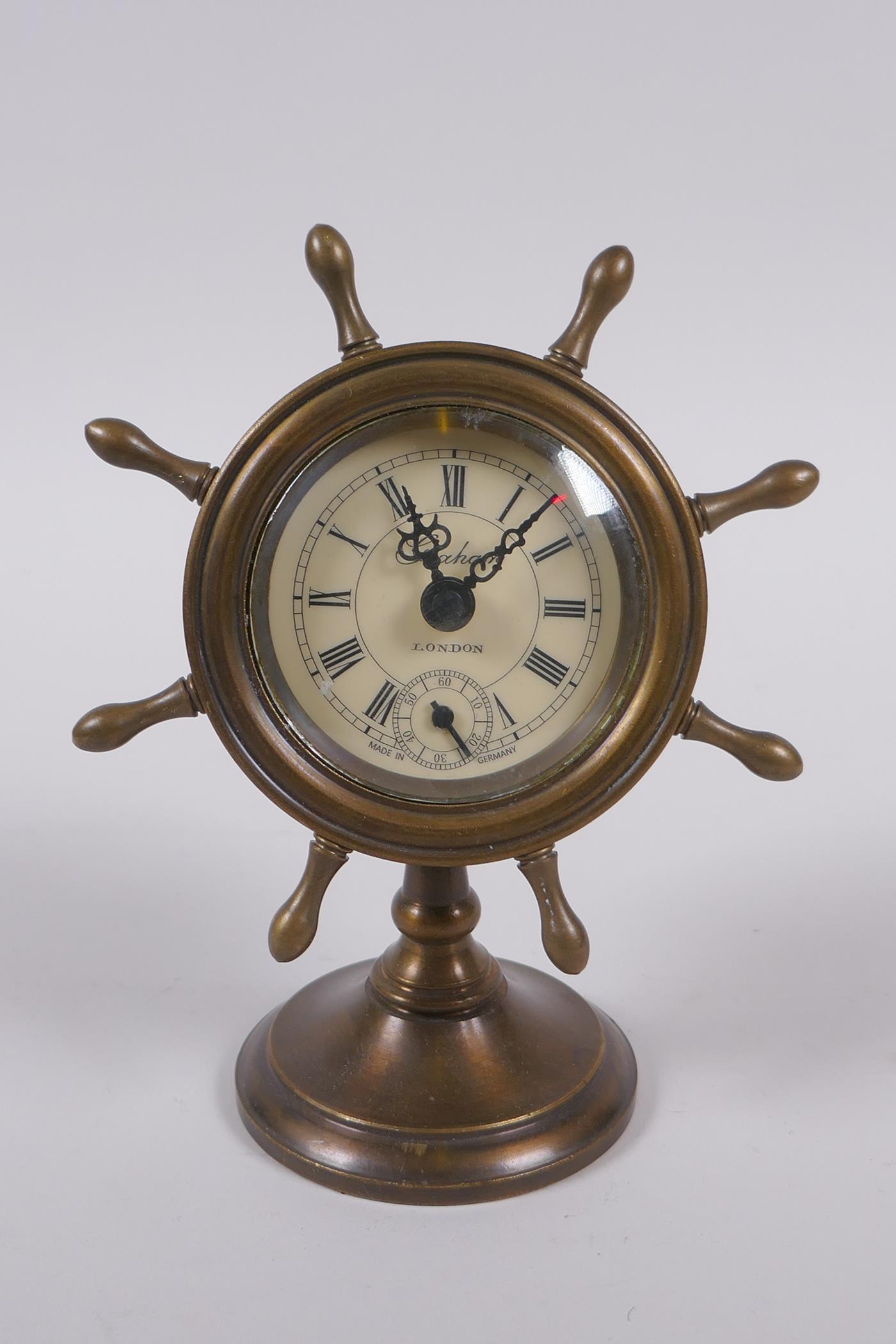 A brass cased desk clock in the form of a ship's wheel, 16cm high