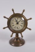 A brass cased desk clock in the form of a ship's wheel, 16cm high
