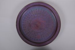 A Chinese Jun ware charger, with chased character inscription and phoenix decoration, character