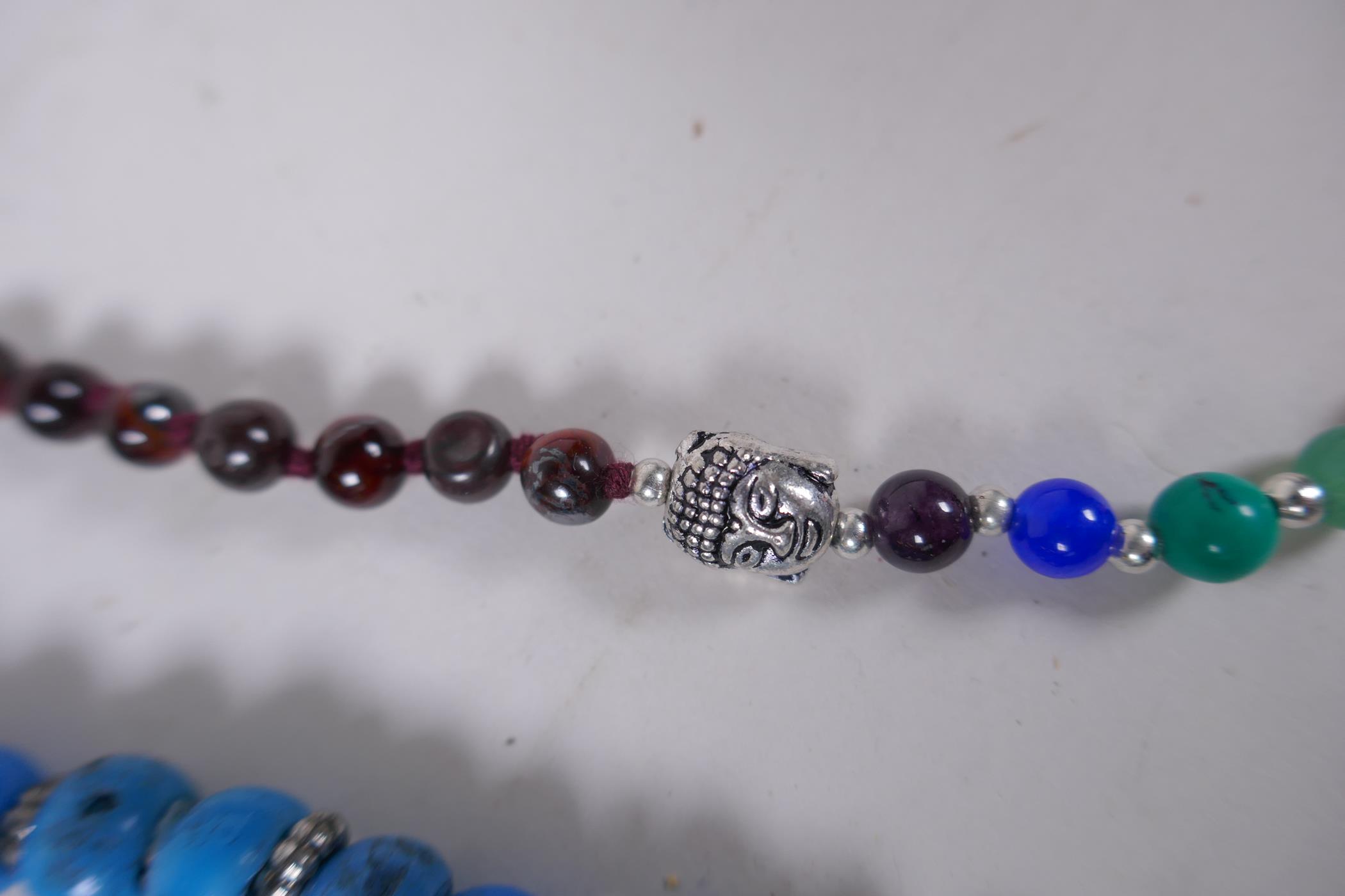 A string of blue and red glass mala beads, a string of tiger's eye mala beads, a string of dried - Image 3 of 6