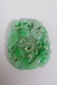 A Chinese carved mottled green jade pendant decorated with flowers, a gourd , kylin and pi disc, 7 x