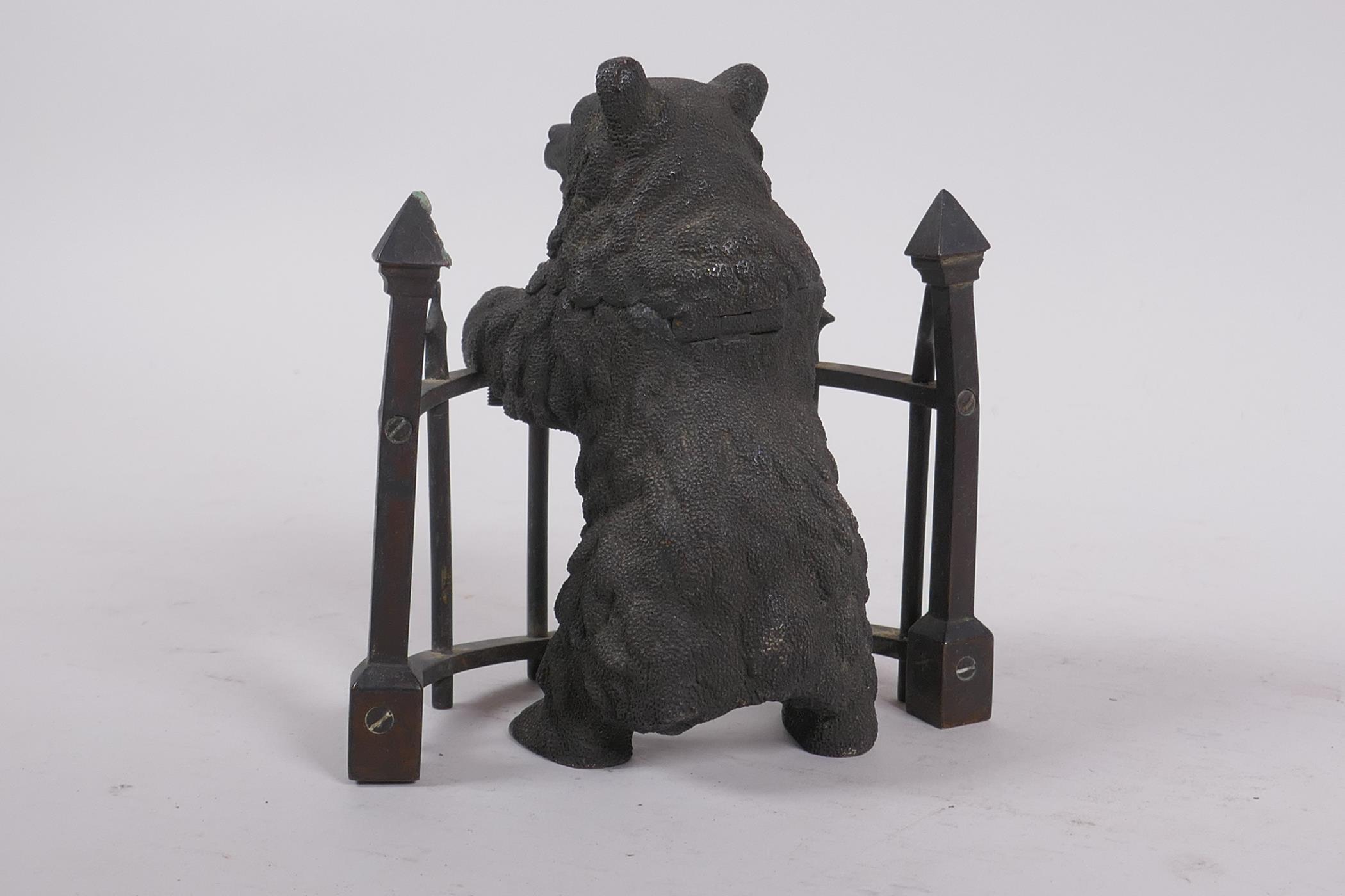 A C19th finely cast patinated bronze inkwell in the form of a bear behind railings, 12cm high - Image 4 of 7