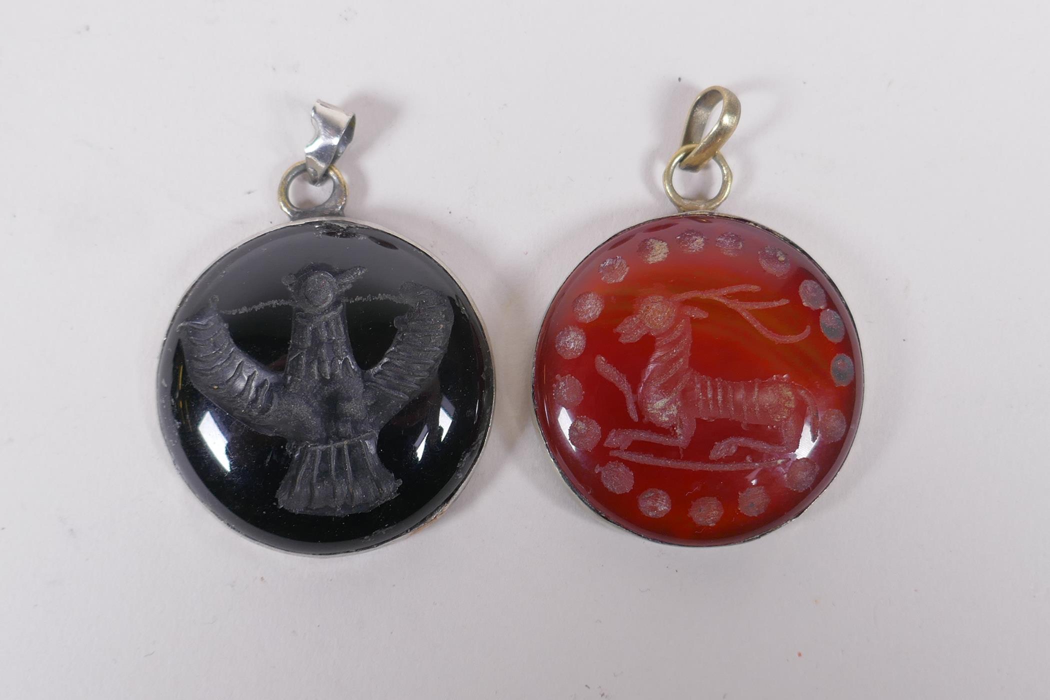 Two Islamic white metal intaglio rings and two similar pendants, largest 4cm diameter - Image 2 of 4