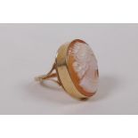 A 9ct gold dress ring, set with a cameo, Birmingham 1976, size N, gross weight 4.2g, with valuer's