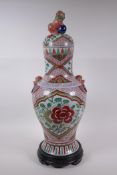 A Chinese porcelain jar and cover with two kylin mask handles, Fo dog knop and red and green