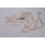 A three string graduated pearl necklace with silver and diamante clasp, AF, a single strand necklace