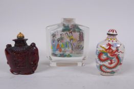 A Chinese reverse decorated glass snuff bottle, a Canton enamel dragon snuff bottle, and a faux horn