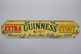 A vintage style Guinness Extra Stout enamel advertising sign, 57 x 12cm