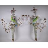 A pair of two branch porcelain and gilt metal parrot wall sconces decorated in bright enamels, 52