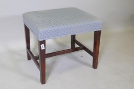 A C19th mahogany stool, raised on square tapering supports united by an H stretcher, 51 x 44 x 46cm