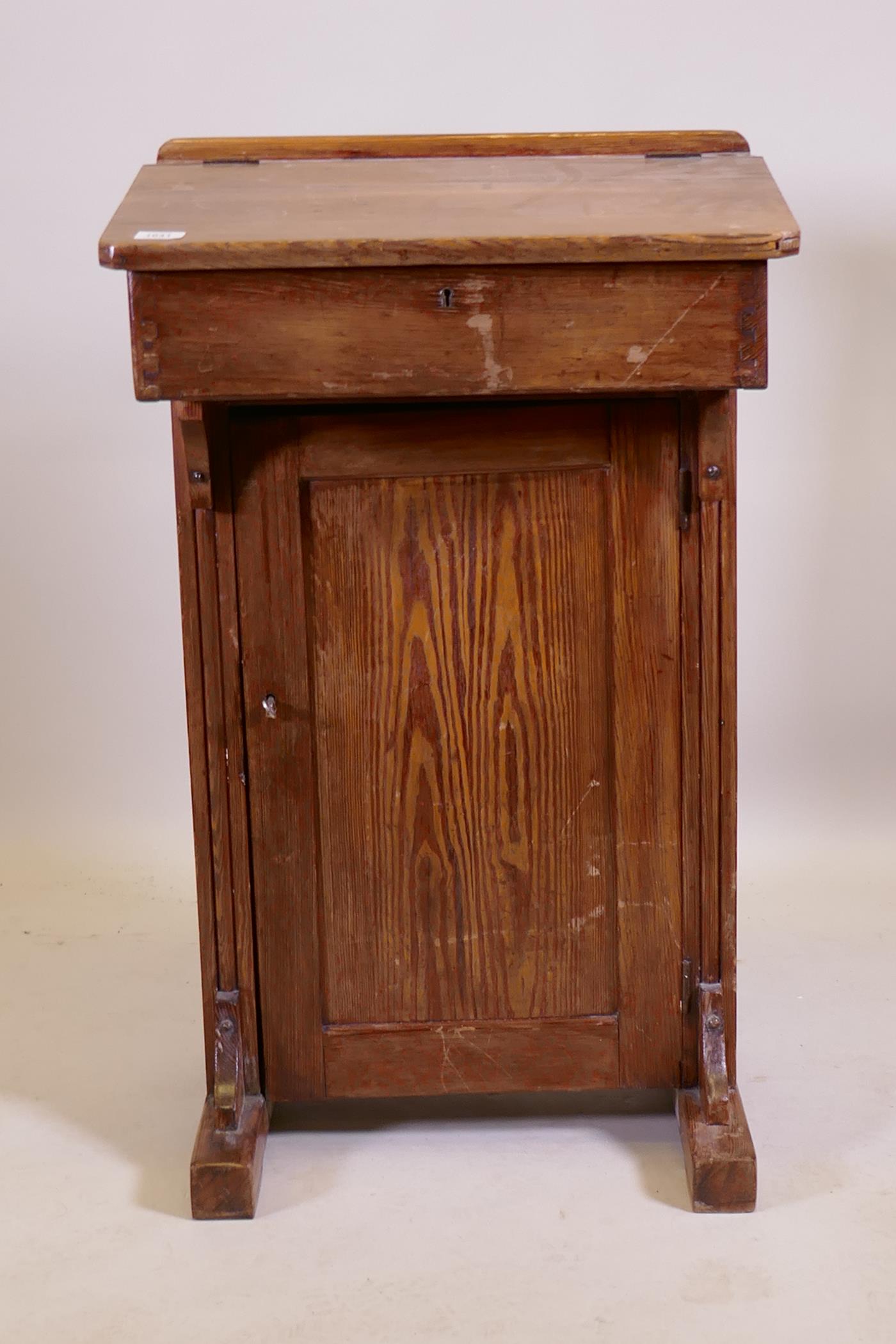 An antique pine clerk's desk, 56 x 42cm, 93cm high