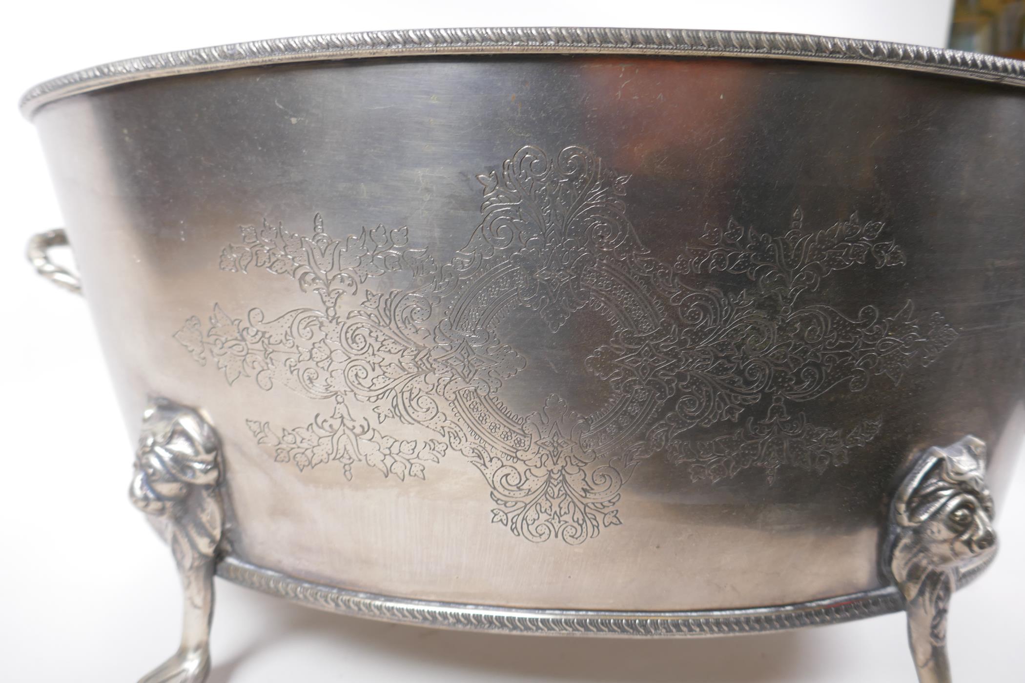 A silver plated champagne cooler with two handles, lion's mask and paw feet, 52 x 35cm, 24cm high - Image 5 of 5