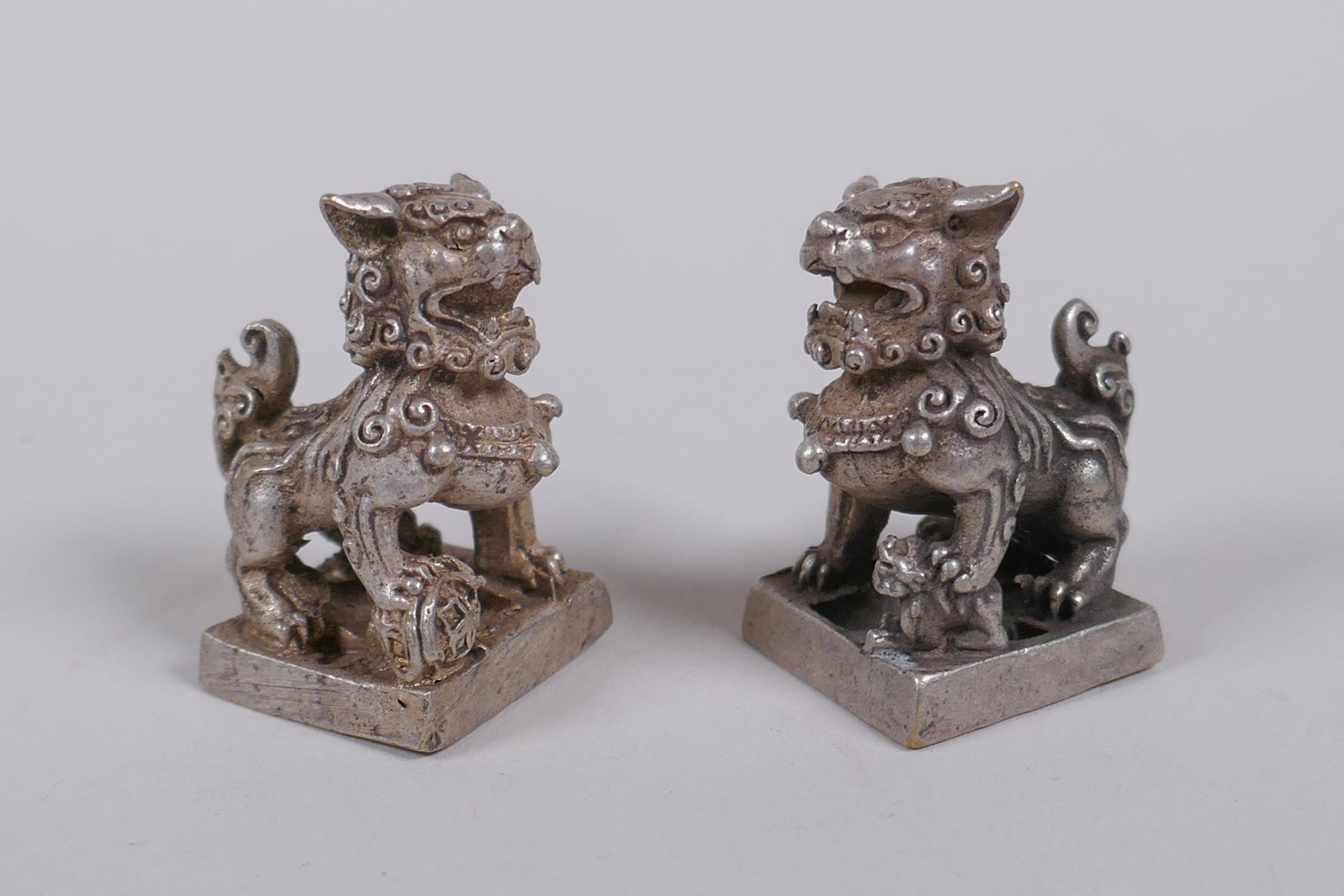 A pair of Chinese white metal seals with Fo dog knops, 3cm high - Image 2 of 3