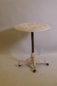 A painted wrought iron garden table with paw feet and brass castors, 60cm diameter, 68cm high