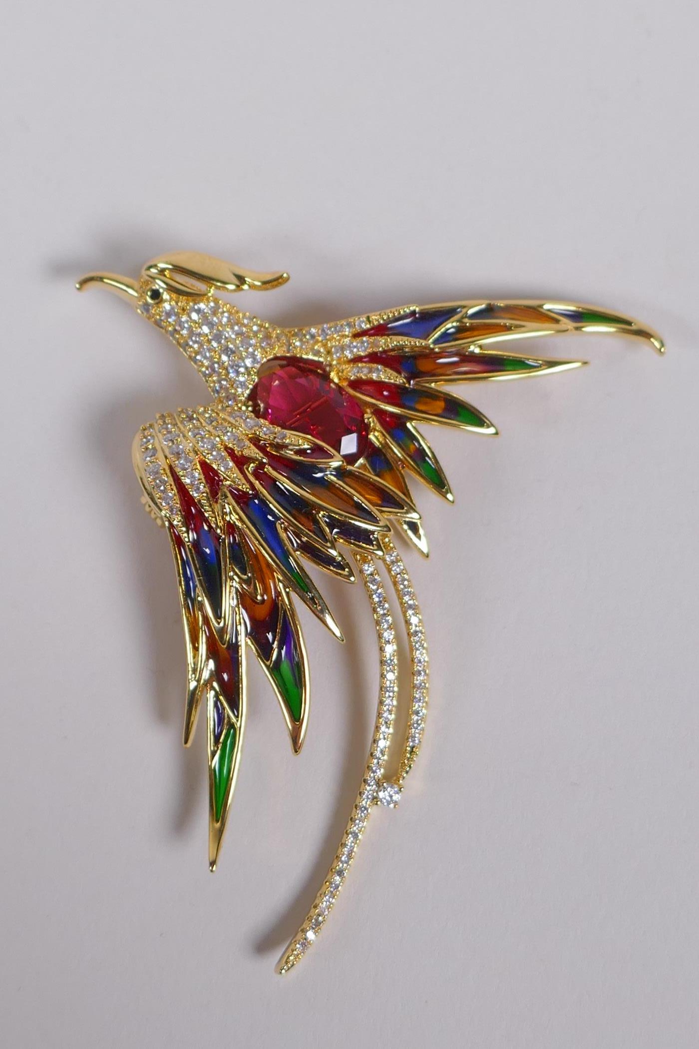 A gilt metal and plique a jour phoenix brooch, 7cm long