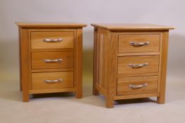 A pair of oak three drawer bedside chests, 50 x 40 x 57cm
