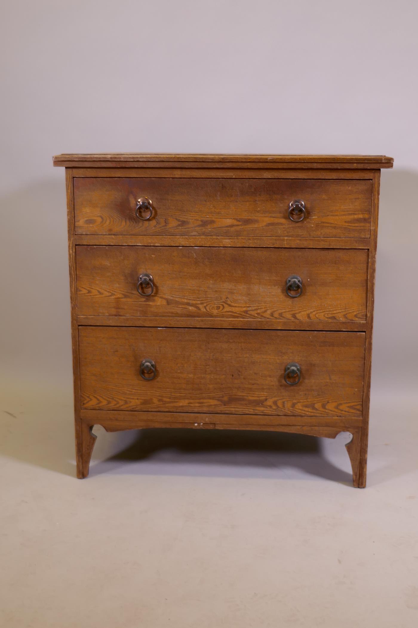 An Arts & Crafts oak three drawer chest, raised on shaped supports, 74 x 49 x 77cm - Image 2 of 4