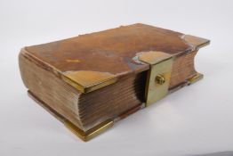 An antique leather bound bank ledger with brass mounts and a Bramah of London lock, lacks key, 28