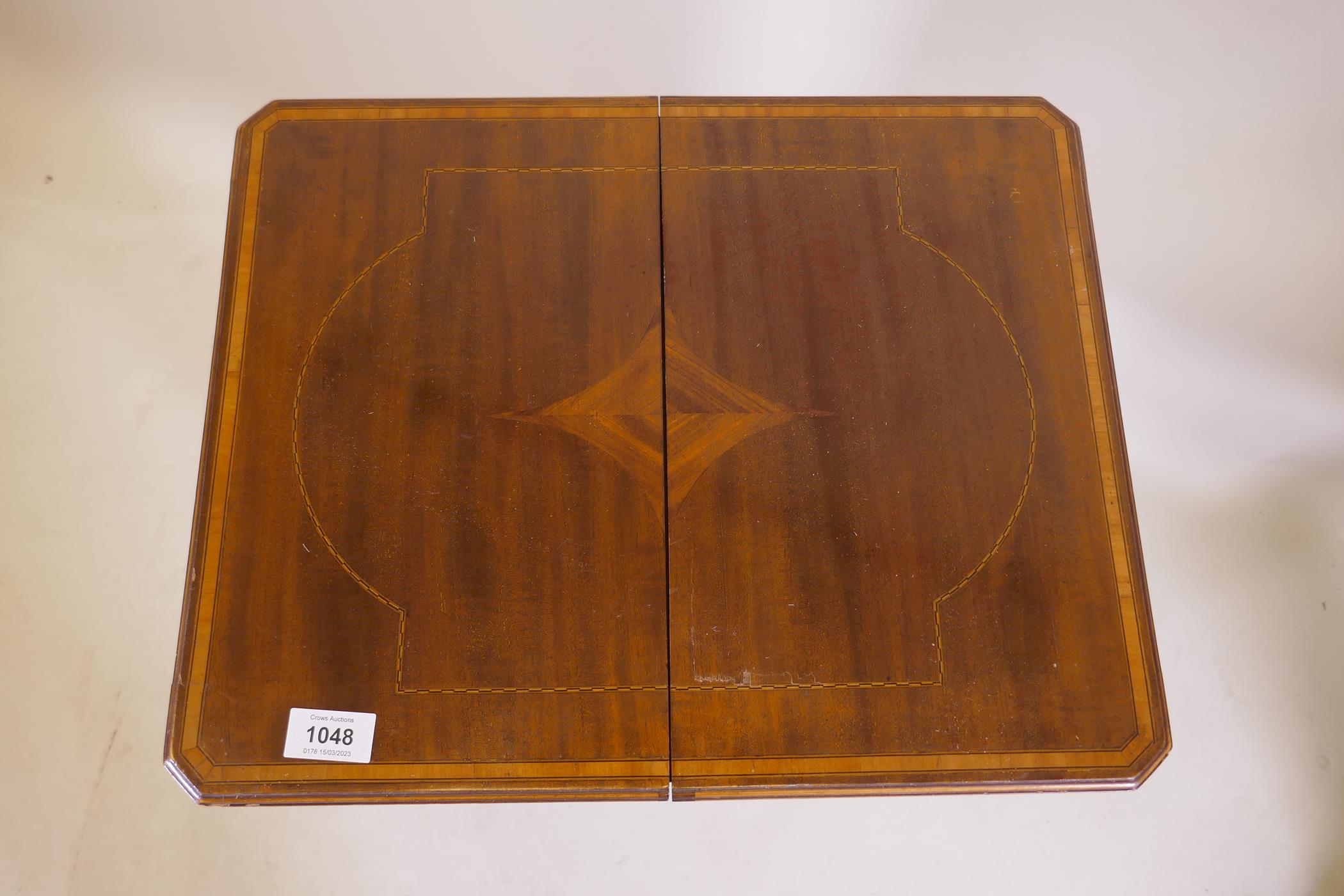 An Edwardian inlaid mahogany work table, the fold over top opening to reveal a fitted interior - Image 8 of 8
