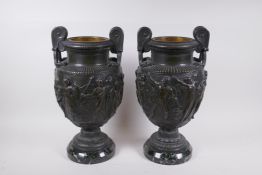 A pair of Grand Tour bronze urns on marble bases, decorated with Greco Roman figures, 41cm high