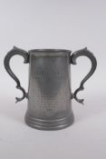 An antique twin handled pewter trophy for the Cambridge Caius College boat club senior trial eights,